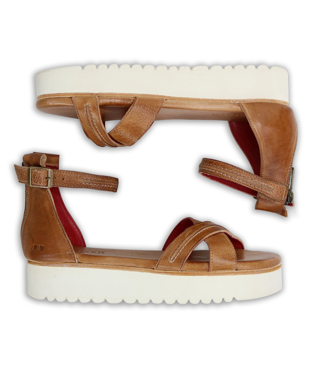 A pair of Carroll sandals by Bed Stu with red soles.