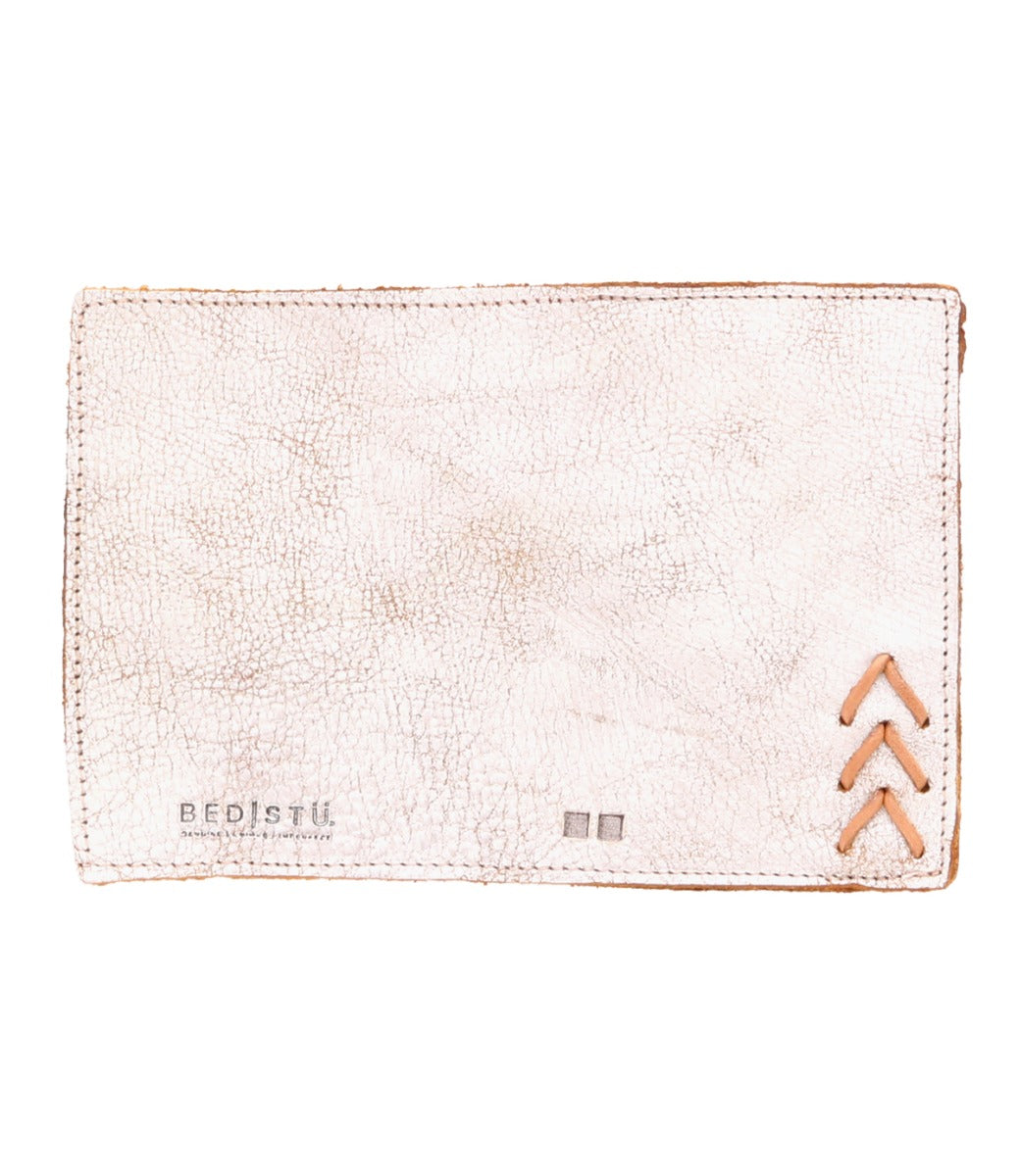 A white leather Stardust wallet with an arrow on it from Bed Stu.