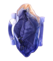 The inside of a blue bag with Bed Stu handles.