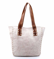 A white Stevie tote bag with brown handles by Bed Stu.