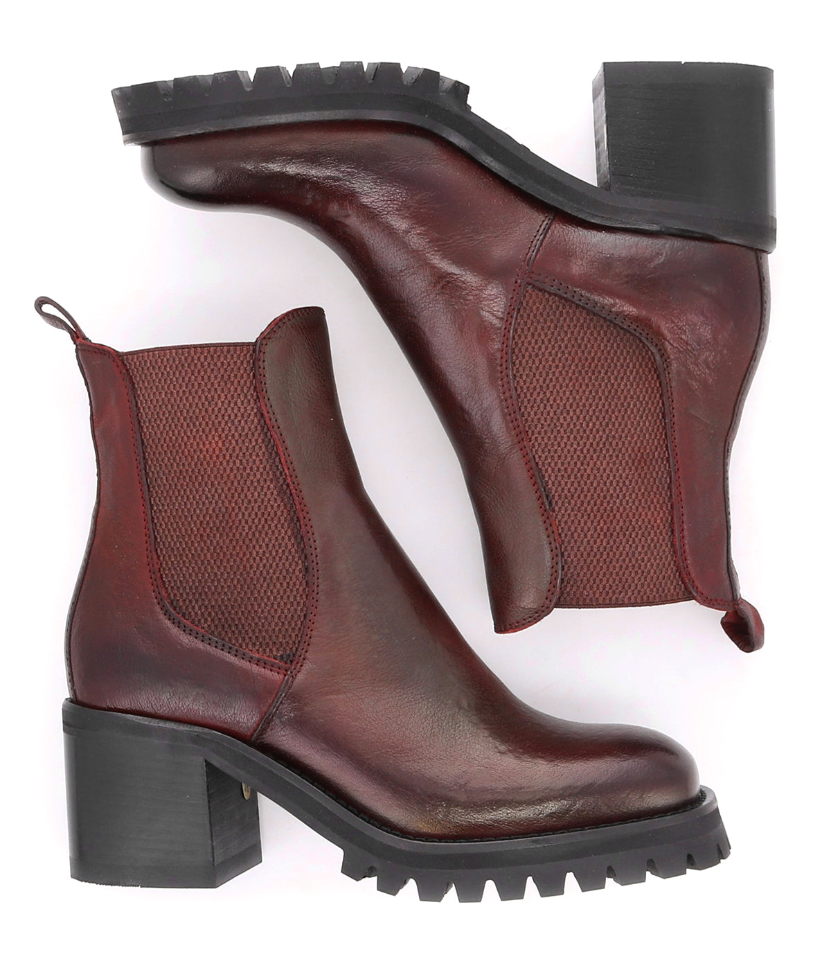 A pair of Bed Stu Surge Italian leather Chelsea boots with a higher heel on a white background.