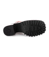 An elegant Surge woman's shoe with black soles on a white background, crafted with Italian leather by Bed Stu.