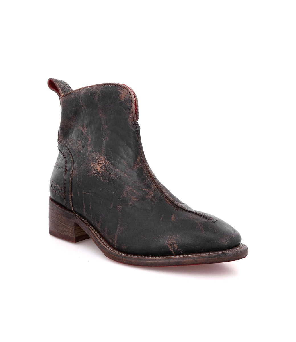A black leather Tabitha ankle boot with a brown sole by Bed Stu.