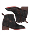 A pair of Tabitha black leather ankle boots with red soles by Bed Stu.