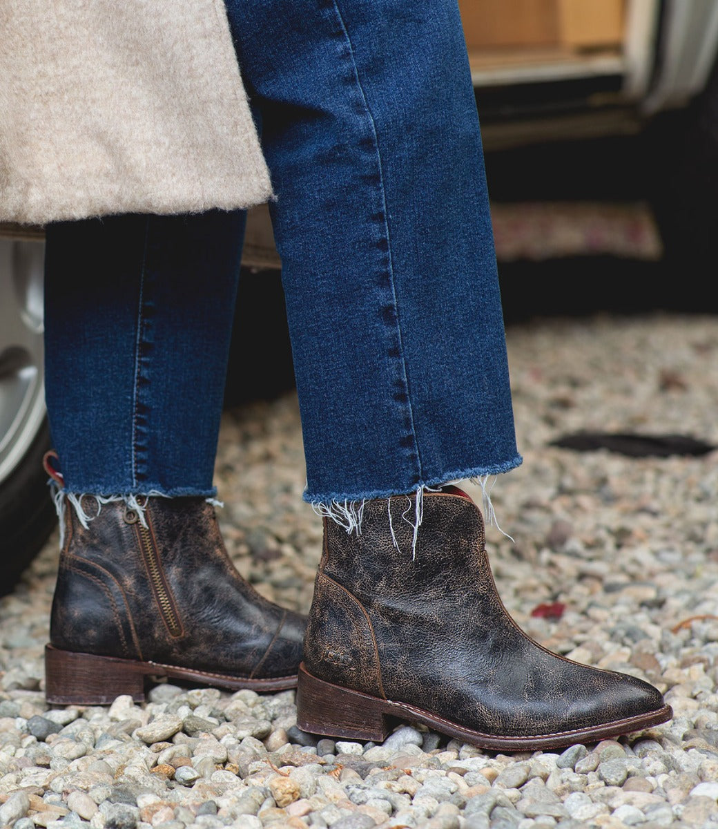 A woman wearing jeans and a pair of Bed Stu Tabitha boots.