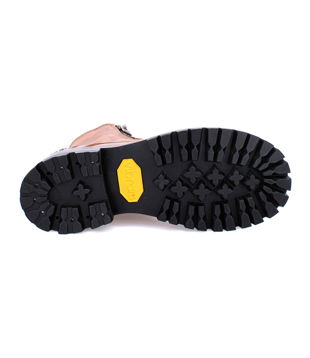 A pair of Tactic Trek hiking boots with yellow soles on a white background made by Bed Stu.