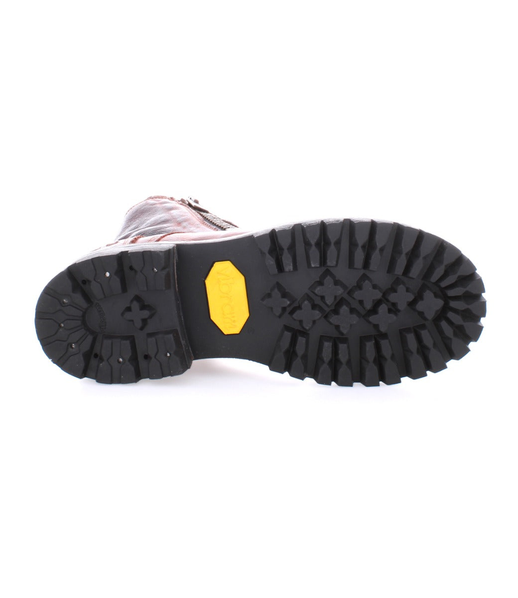 A pair of Tactic Trek boots by Bed Stu with yellow soles on a white background.
