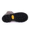 A pair of Bed Stu Tactic Trek brown boots with yellow soles on a white background.