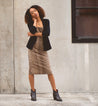 A woman wearing a Tania leopard print dress and Bed Stu blazer.