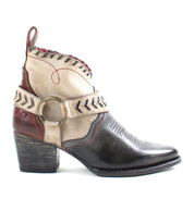 A women's Tania cowboy boot with a buckle and straps from the Bed Stu brand.