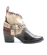 A women's Tania cowboy boot with a buckle and straps from the Bed Stu brand.