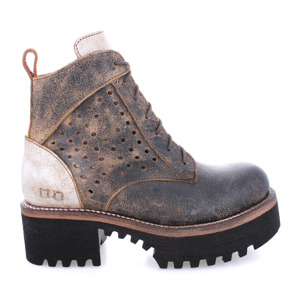 A women's brown leather Tanzania boot with holes on the sole by Bed Stu.
