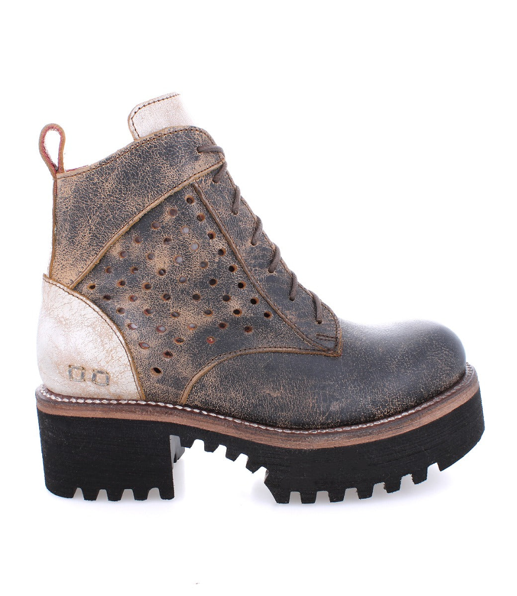 A women's brown leather Tanzania boot with holes on the sole by Bed Stu.
