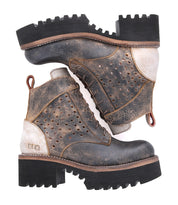A pair of Bed Stu Tanzania women's boots with a leather sole.