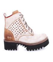 A women's Tanzania ankle boot with holes and a black sole by Bed Stu.