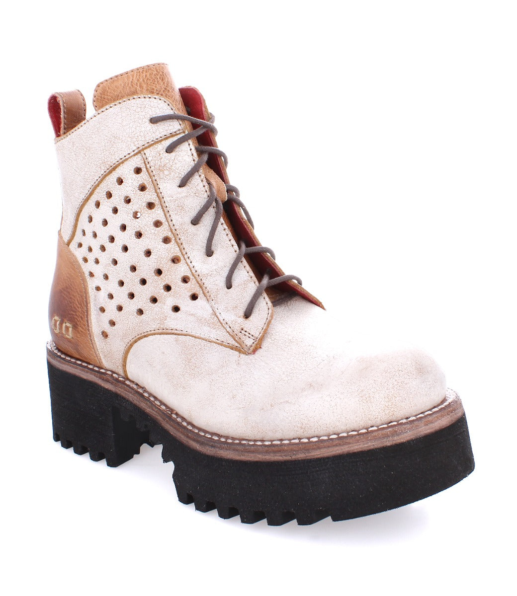 A women's Tanzania by Bed Stu, white and brown boot with a perforated sole.