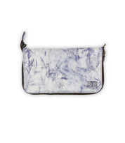 The Bed Stu Templeton II is a chic clutch purse with a marbled white and purple texture featuring a small logo patch on the lower right corner. Its versatile design allows it to transform easily into a stylish crossbody for any occasion.