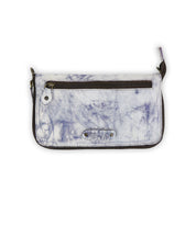 The Templeton II by Bed Stu is a rectangular white and gray marbled leather wallet that features a front zipper pocket and a wrist strap, making it a chic clutch for any occasion.