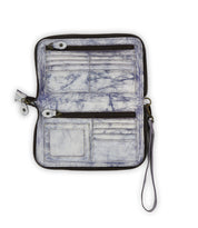 The Templeton II by Bed Stu is a versatile leather wallet in marbled white and blue, featuring card slots, a transparent ID window, zippered compartments, and a wrist strap. It effortlessly transitions from a clutch to a crossbody for any occasion.