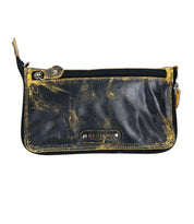 The Templeton II by Bed Stu is a black leather zip pouch featuring yellow distressed markings and the brand name displayed on a metal plate, making it a versatile piece that doubles as a chic clutch.