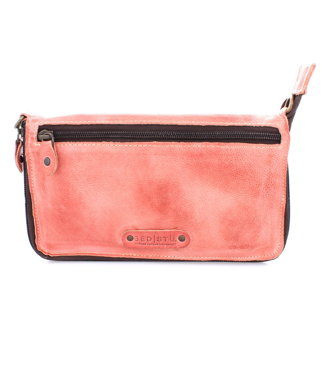 A Templeton II pink leather clutch with a zipper from Bed Stu.