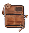 The inside of a Templeton II tan leather multi-functional clutch from Bed Stu.
