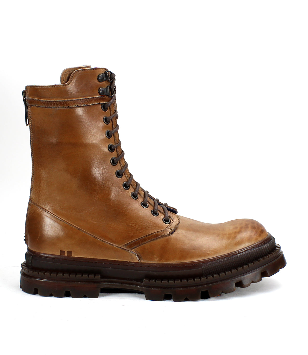 The Bed Stu Tempt is a stylish brown leather lace-up boot, blending the classic Chelsea look with hiking boot durability. It features a rugged rubber sole, back zipper, and side profile design.