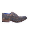A men's brown oxford shoe with blue soles, the Thorn by Bed Stu.