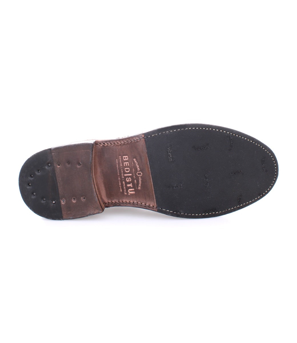 A men's Thorn shoe with brown and black soles from the Bed Stu brand.