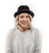 A woman wearing a Turino hat and Bed Stu white shirt.