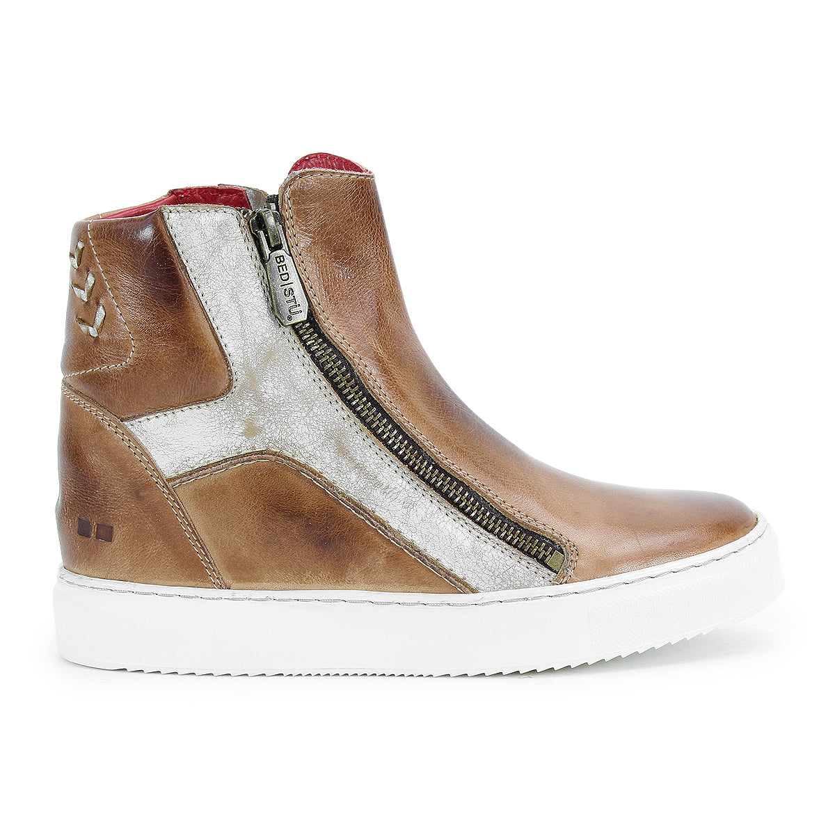 The Bed Stu Twist is a brown leather high-top sneaker with a white sole, side zipper, metallic silver accents, leather panels, red inner lining, heel stitching detail, and a subtle hidden wedge for extra height.
