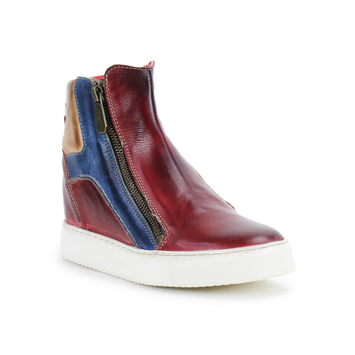 The Bed Stu Twist is a red high-top sneaker with blue and tan leather panels, a hidden wedge, side zipper, and white rubber sole, shown on a plain white background.