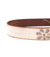 An Upswing white leather belt with a gold buckle by Bed Stu.