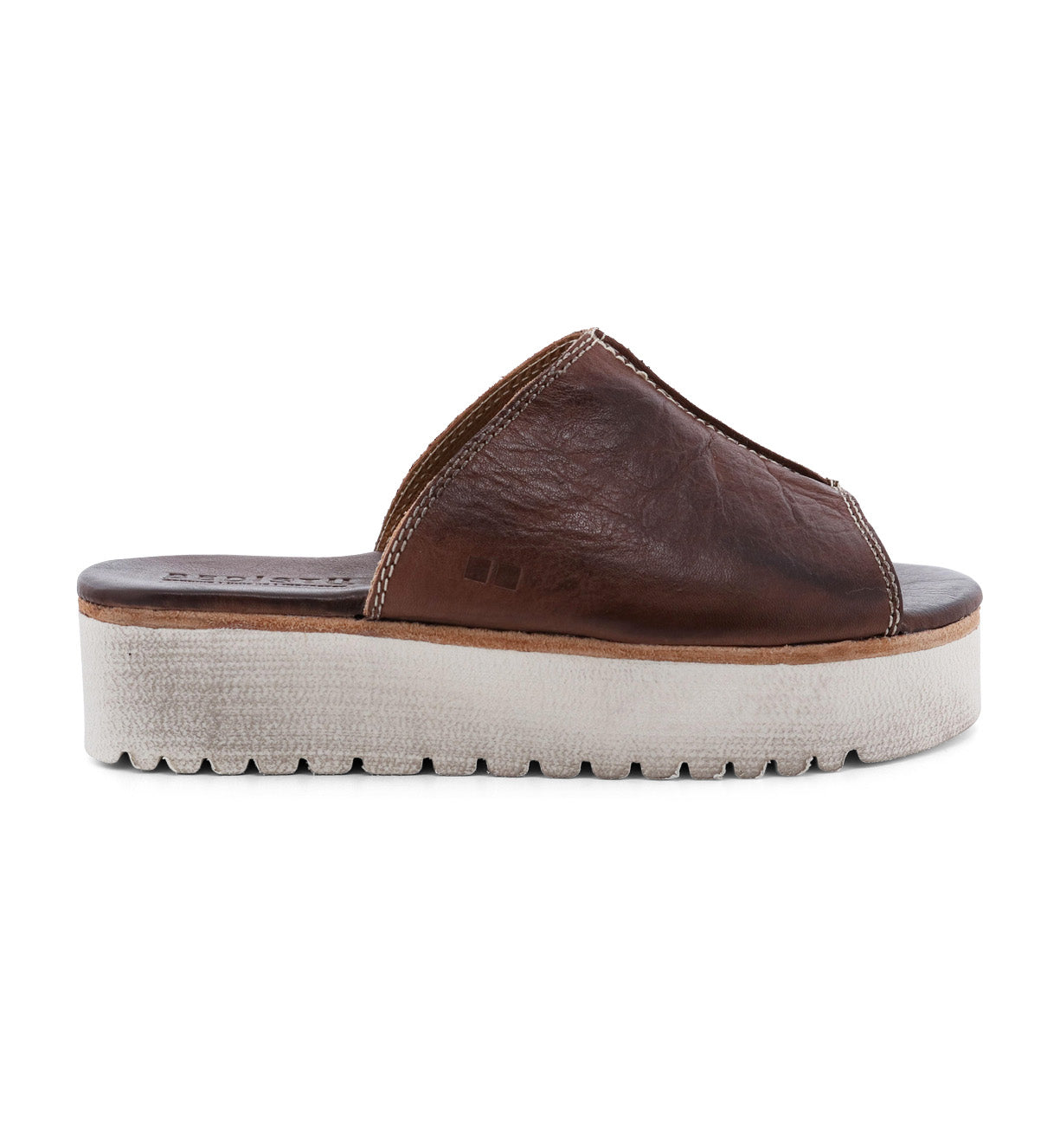 A women's Fairlee II brown leather slide sandal with a white sole, from the brand Bed Stu.