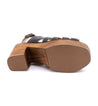 The bottom of a women's Fontella sandal with a wooden heel by Bed Stu.