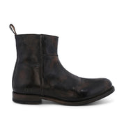 A single black leather ankle boot with a distressed finish, featuring a pull tab at the back and designed for comfort, isolated on a white background by Bed Stu's Kaldi.