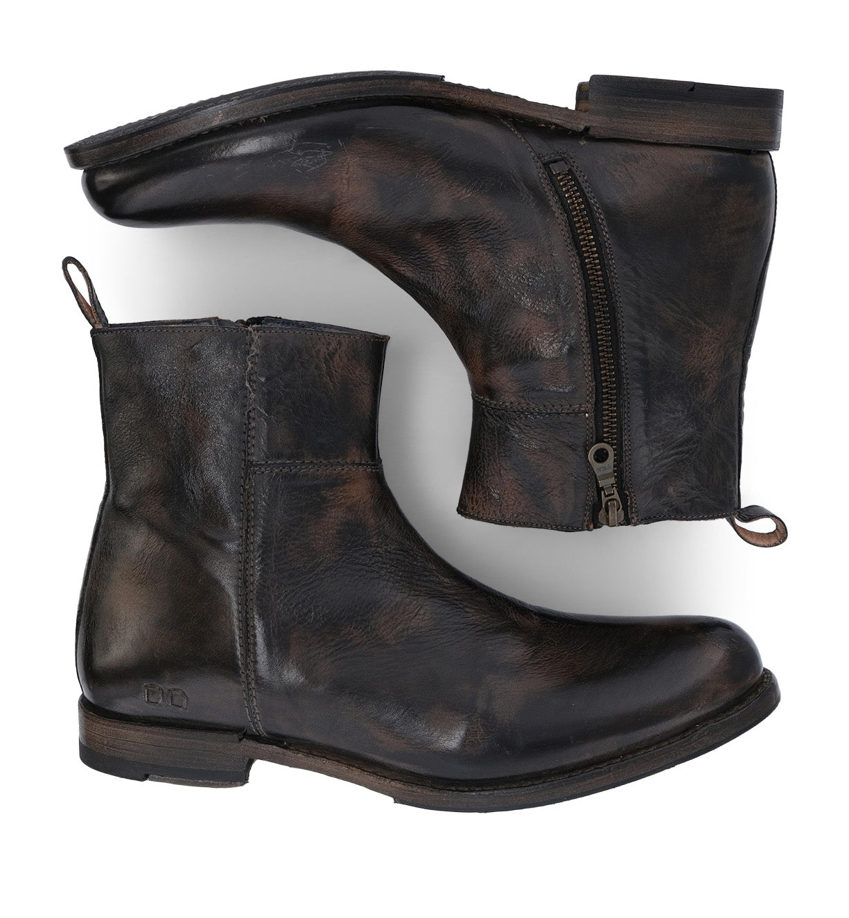 A pair of comfortable, dark brown leather ankle boots with zippers, photographed from above on a white background by Bed Stu's Kaldi.