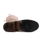 A close up of a Bed Stu Manchester shoe on a white surface.