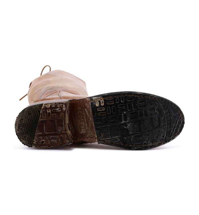 A close up of a Bed Stu Manchester shoe on a white surface.