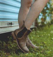 A woman wearing Nandi taupe pure leather chelsea boots.