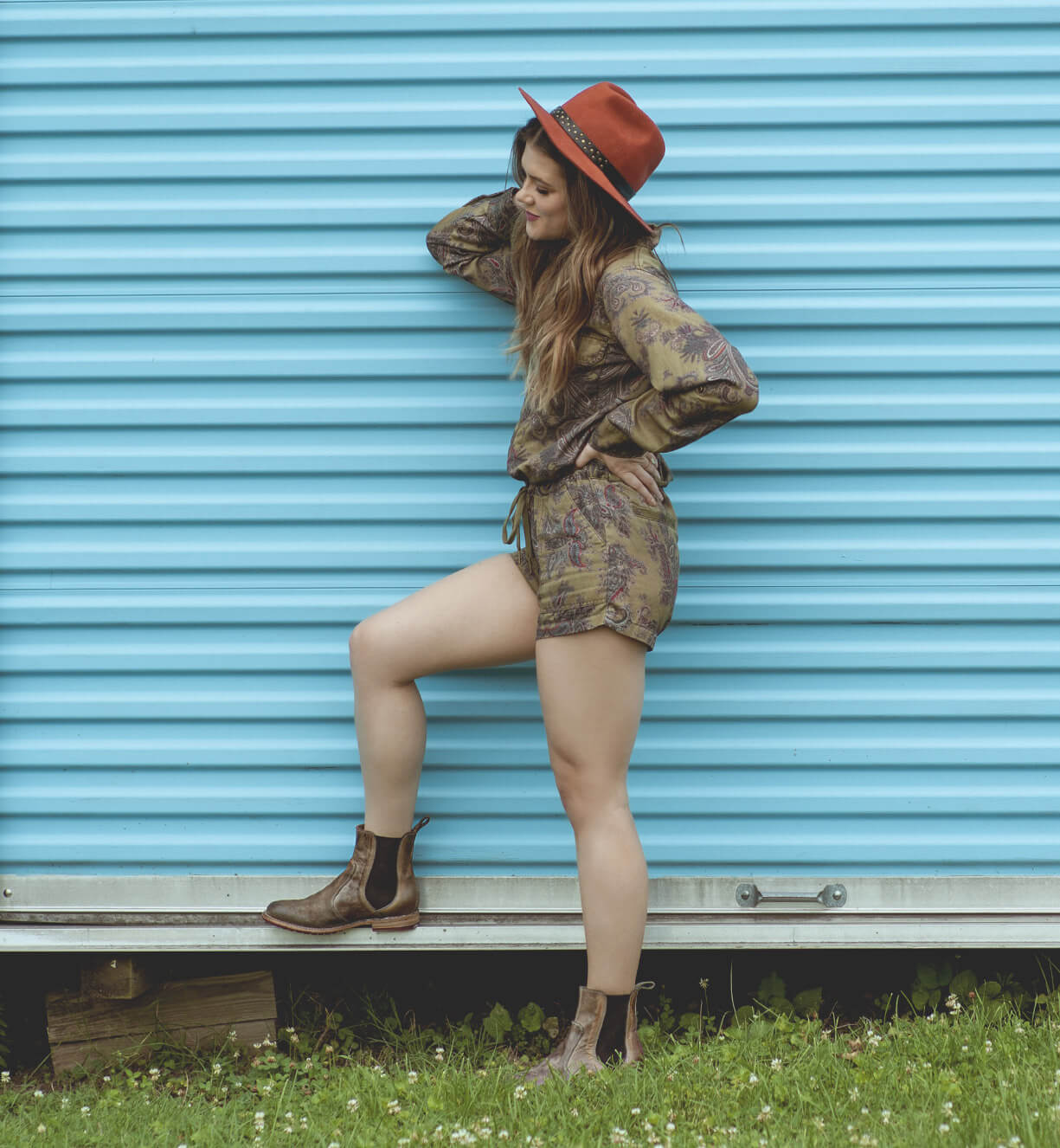 A woman wearing Nandi taupe vegetable tanned leather chelsea boots.