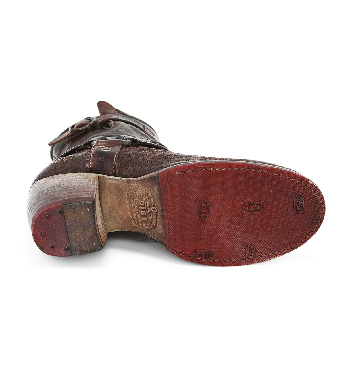 A pair of Octane II cowboy boots by Bed Stu with red soles.