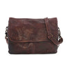 A brown leather Ziggy messenger bag with a shoulder strap by Bed Stu.