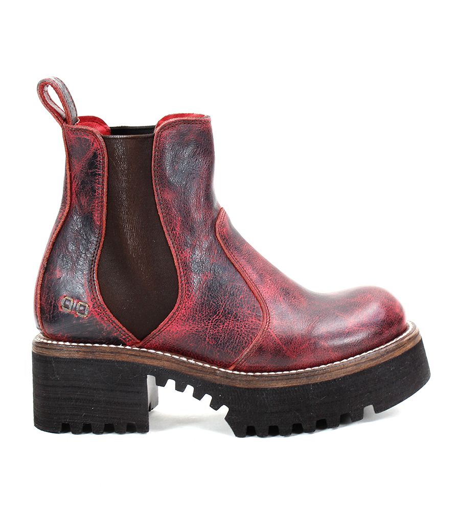 The Valda Hi by Bed Stu is a red leather Chelsea boot that features a chunky black rubber platform sole, a convenient pull tab on the back, and elastic side panels for effortless slip-on.