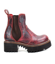 The Valda Hi by Bed Stu is a red leather Chelsea boot that features a chunky black rubber platform sole, a convenient pull tab on the back, and elastic side panels for effortless slip-on.