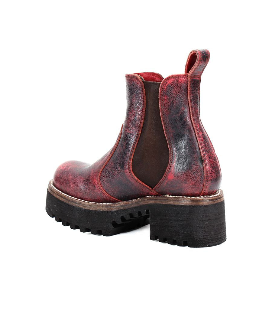 The Valda Hi by Bed Stu is a red and black leather Chelsea boot featuring a chunky heel, platform sole, and stretchy side panels.