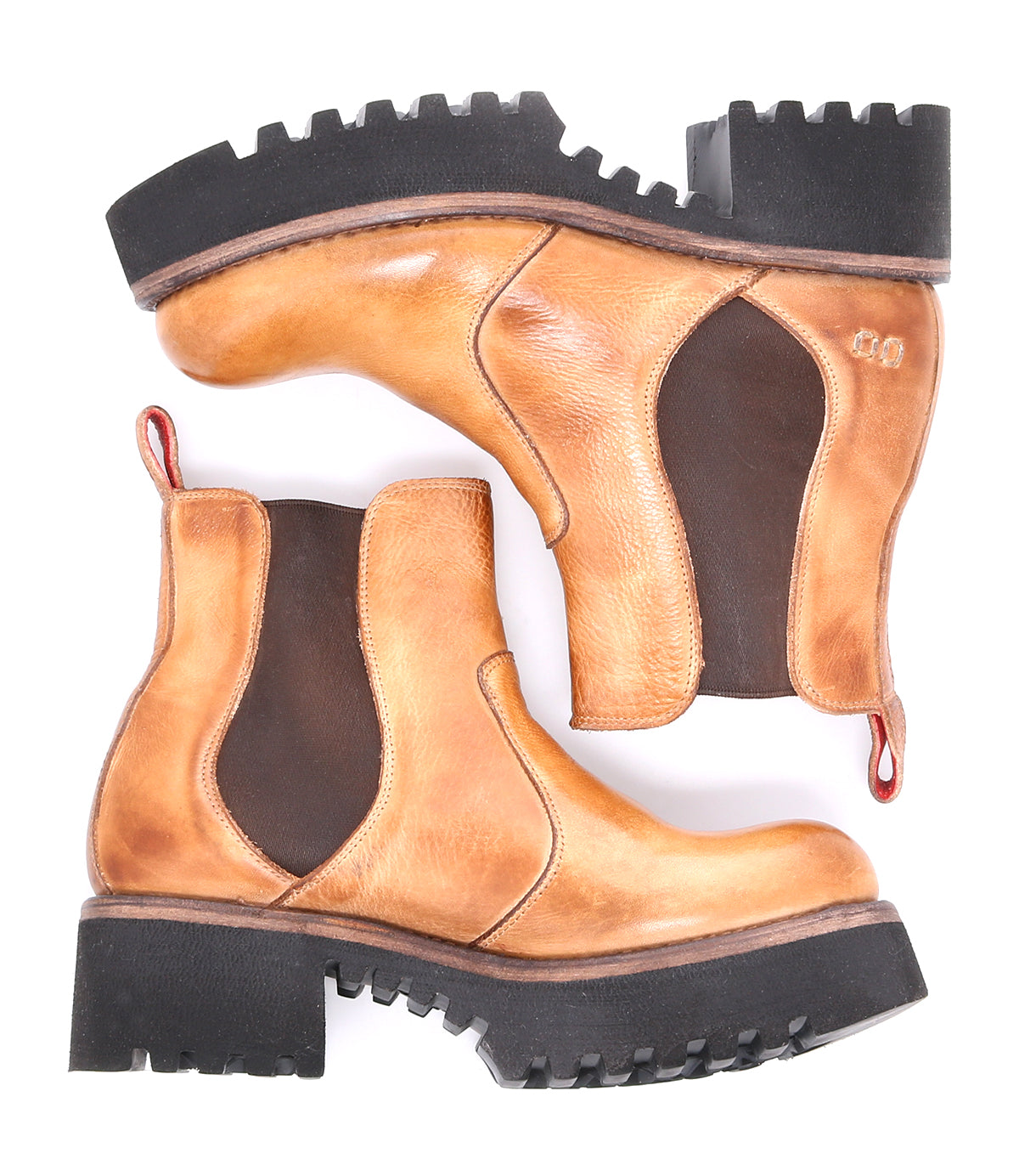 A pair of tan Bed Stu Valda Hi leather boots on a white background.