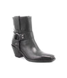 An Italian women's black leather ankle boot with harness buckles, the Vamoose by Bed Stu.