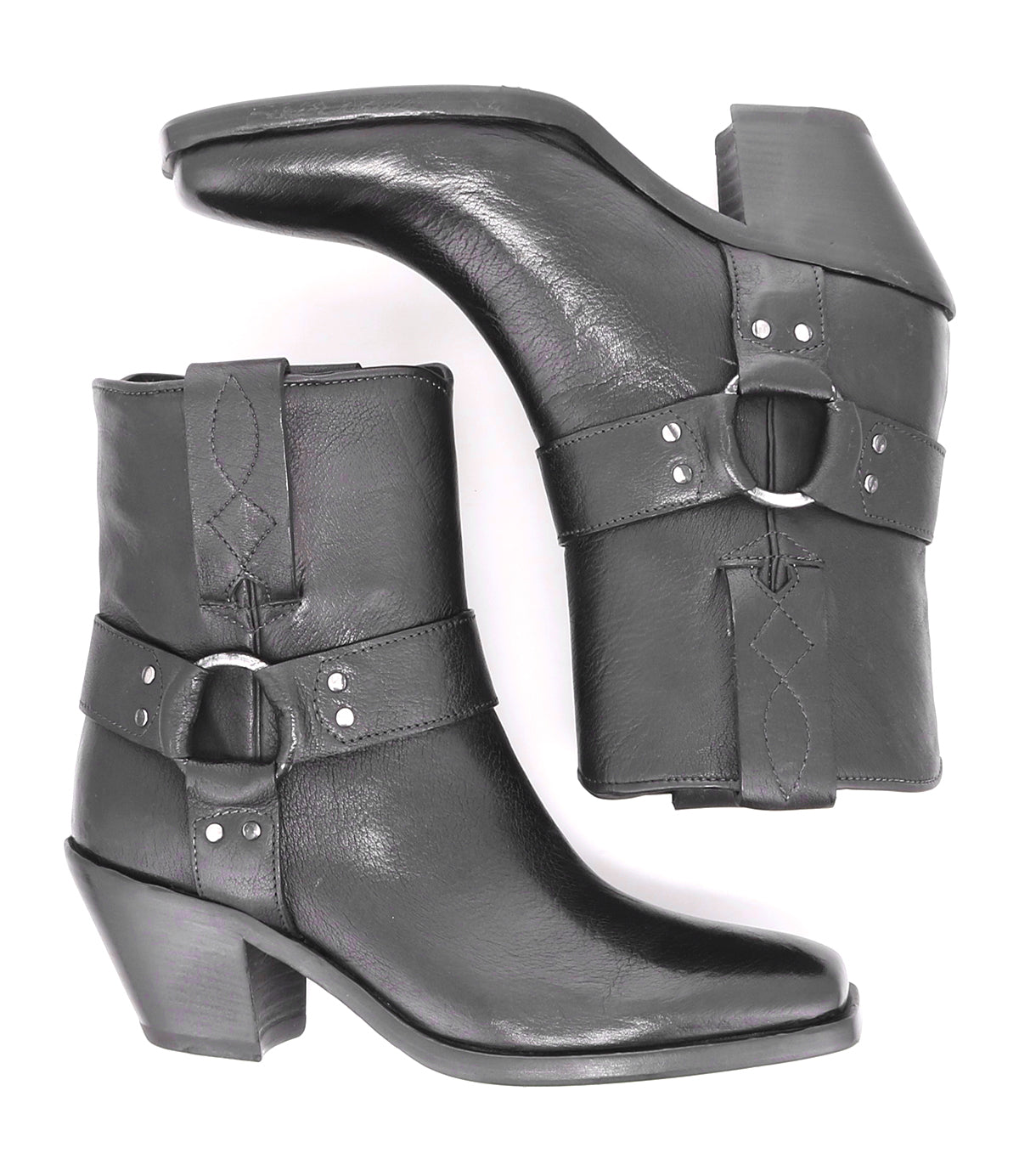 A pair of Bed Stu Vamoose Italian black leather ankle boots with buckles.