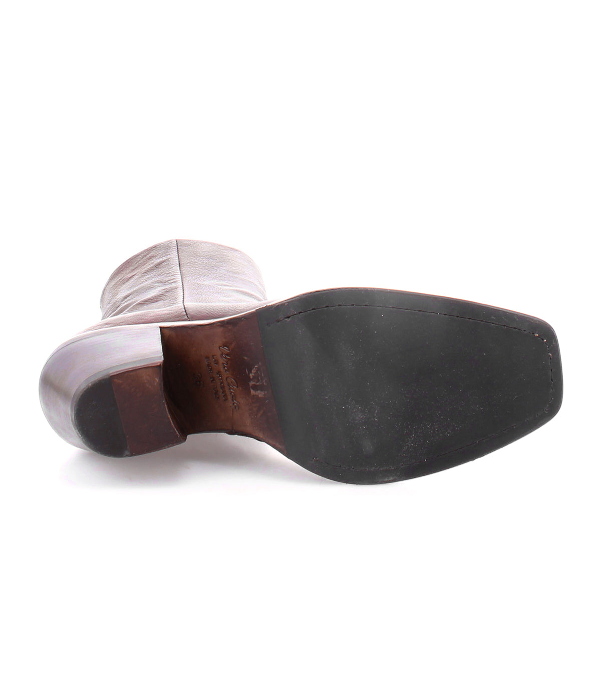 A pair of high-quality Vendue leather boots with a sleek silhouette on a white background.